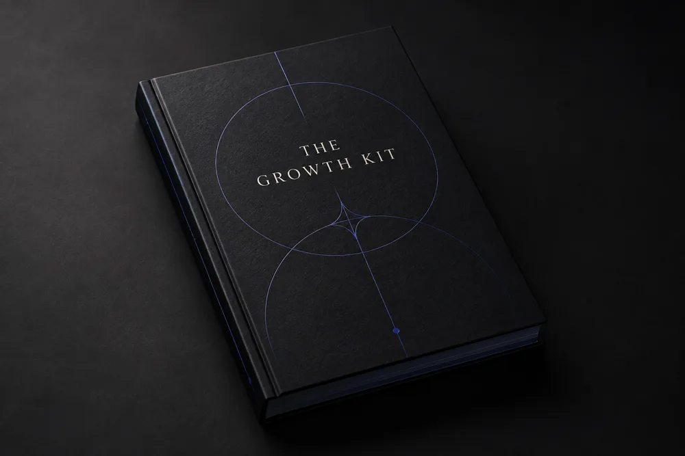 Concept preview: black Growth Kit workbook with indigo foil linework